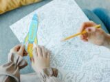 Hands of a Child Drawing with their Mom