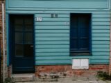 Door and Window of Little House with Timber Facade