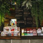 Bar with sweets and water decorated with plants