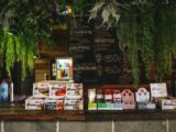 Bar with sweets and water decorated with plants