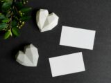 White Papers Besides Heart Shape Paperweight