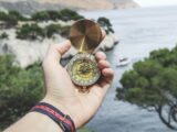 Person Holding Compass