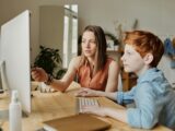 Photo Of Woman Tutoring Young Boy