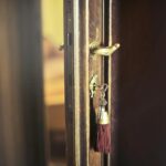 Key with trinket in shabby door