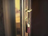 Key with trinket in shabby door