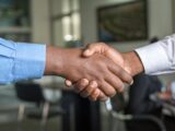 Two Person in Long-sleeved Shirt Shakehand