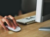 Person Holding Apple Magic Mouse