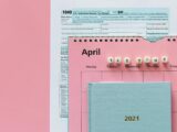 Tax Return Form and 2021 Planner on Pink Surface