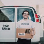 Man Carrying a Box of Food