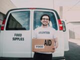 Man Carrying a Box of Food